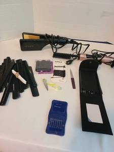 lot 2136 image: Tervilix electric hot comb, Revlon flat iron, combs, blemish kit, collar stays