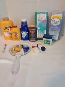 lot 2142 image: Cotton swabs, Gold Bond body powders, hand mirror,  more