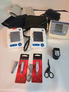lot 2144 image: Pulse oximeter,  3 blood pressure monitors, nail clippers