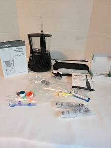 lot 2146 image: Waterpik and Pro-Sys VarioSonic power toothbrush with accessories