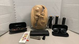 lot 2231 image: Mixed Lot Carved Wood Face Sculpture, Polo Ralph Lauren Eyeglasses, Clip-On Sunglasses, 3 Flashlights, Eyeglass Case