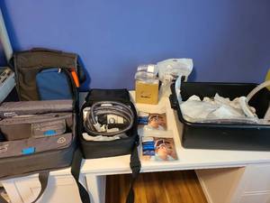 lot 2503 image: ResMed C-pap machine, 2 cases, and supplies, plus a storage tub