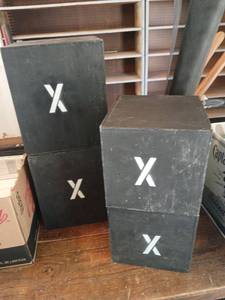 lot 4112 image: Black Box Risers with White X Mark Set of 4, 2  are 1ft x10x10 2 are 9x9x9