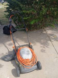 lot 4241 image: Electric Lawn Mower with Extension Cord Orange Black untested