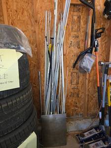 lot 4503 image: Poles, pipes and towels in metal can