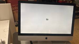 lot 1184 image: Apple iMac 21.5-inch All-in-One Desktop Computer. Has blinking file folder.