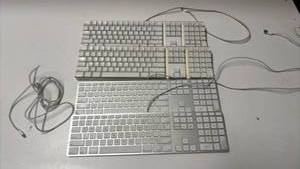 lot 1186 image: Lot of 4 Apple Wireless and Wired Keyboards with USB Cables