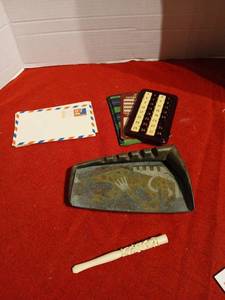lot 1231 image: Vintage ivory style cigarette holder, mid century cast bronze or brass hammered finish ashtray, vintage puzzle, and 5 cent postcards