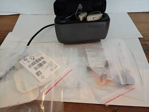 lot 2510 image: Pair of ReSound Hearing Aids with Extra Ear Protectors