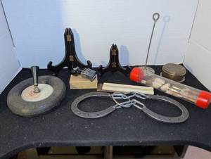 lot 3055 image: Vintage Goodrich tire pen holder, display easels, stamp, horse shoe game and animal teeth