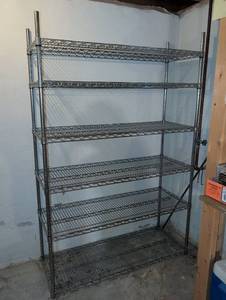 lot 3018 image: Wire Shelving Unit 72x47x18 . Located in basement. Pickup towards end of load out. Shelf is in use.