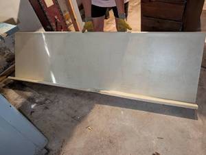 lot 3131 image: Counter top 86x25 inches with some water damage. Located in basement