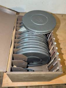 lot 3133 image: Metal film reels and cans,  8mm and 16mm in case