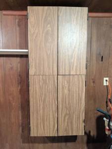 lot 3145 image: 59x26x13 Particle board wall storage located in basement. Bring tools to remove from wall