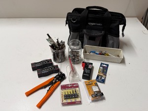 lot 1403 image: Tool Lot with Drill Bits in Amazon Basics Bag