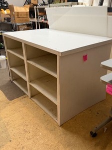 lot 1386 image: Laminate and wood cubby 37 x 37 x 61 in located in studio. Remove through double doors nearby