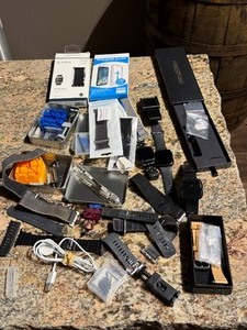 lot 1122 image: Apple  Smartwatchs and Accessories Lot with Bands Screen Protectors Charging Cord