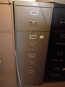 lot 3203 image: Metal Filing Cabinet.  4 Drawers.  52 x 18 x 27.   Located in basement