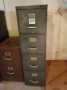 lot 3212 image: Metal Filing Cabinet.  4 Drawers.  52 x 15 x 28.  Located in basement