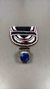 lot 811 image: Sterling silver ring with unknown stone and hand beaded leather belt pouch
