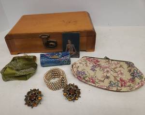 lot 14 image: Vintage Wood Marketry Dresser Jewelry Case, Rhinestone Brooches, 1950s Faux Pearl Wrap Bracelet, Renaissance Floral Clutch, Embroidered Silk Coin Purse, Silk Embroidered Lipstick Case, & 1940s Nudie Pin-Up MIni Mirror 2in x 3in
