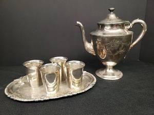 lot 22 image: Vintage Van Bergh Silver Plate Company Quadruple Plate Lidded Tea Pot with Engraved Design, 4 New Amsterdam Silver Co. Plated Cordial Cups, and Embossed W&S Blackinton Silver Plate Serving Tray 10in L x 6.25in W