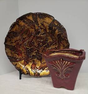 lot 34 image: Oxblood Glaze Embellished Pottery Planter 9in W x 9in L x 9in T, and Large Ox BloodGold Painted Embossed Glass BowlPlatter 18in W on Black Metal Presentation Stand