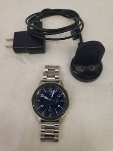 lot 58 image: Samsung Galaxy SM-R800 Smartwatch with Stainless Steel Link Band and Charger with Cord