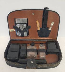 lot 74 image: Vintage Mens Grooming Travel Kit - in Genuine Leather Case - Made in the U.S.A. - Lidded Glass Bottles, Celluloid Cases, 2 Mirrors, Comb, Manicure Tools, & Lift Out Tray
