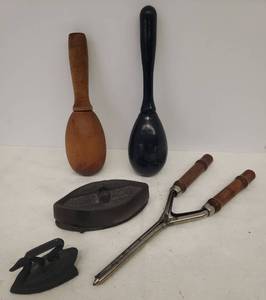 lot 79 image: Vintage House Wares Small Sad Iron Stamped 1895 with Trivit, Mini Swan Iron, Curling Iron, and 2 Wood Egg Sock Darning Tools