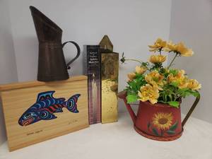 lot 89 image: Brass Fireplace Match Holder, Unopened Box of Fireplace Matches, Copper Clad Metal Pitcher, Tole Painted Wood Watering Can with Floral Arrangement, and Handpainted Salmon Box 10in L x 7.5ini W x 1.5in T