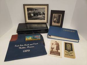 lot 104 image: Vintage Collectibles Black & White Photos, Advertising & Wellness Advertising Pamphlets, Pocket Magnifier, Bonds & Insurance Metal Lock Box, Vintage Ledger Book, and East Side Bank and Trust Wichita, KS Locking Cash Bag