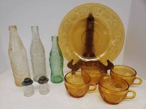 lot 105 image: Vintage Indiana Glass Co. Amber Glass Daisy Pattern Serving Platter - 11.5in W, & 4 Tiara Pattern Coffee Cups, Vintage Glass Soda Bottles Pepsi, Coca-Cola, & NEHI, and Pair of Victory Glass Mini Lantern Candy Pellet Containers with Metal LIds 3.5in T