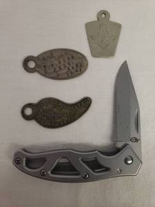 lot 142 image: Vintage 1941 Engraved Metal Masons I.D. TagFob - H.R. Fish Peru, KS - 1.75in L, Masons Pendant 1.25in T,  Embossed Metal I.D. Tag - Equitable Accident Co. Boston, MA, and Gerber Single Flip Blade Knife Model #4660814A
