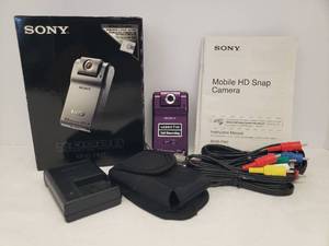 lot 148 image: Sony MP4 Snap Camera - Violet Color - with Picture & Video Capabilities5 Mega Pixels - with Accessories - Rechargeable Battery - in Original Box