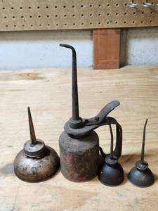 lot 444 image: 4-Piece Vintage Oil Can Set with Spout and Pump Nozzles