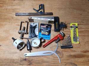lot 476 image: Hand Tools Lot Hole Saws Measuring Tape Wrench Drill Bits and More