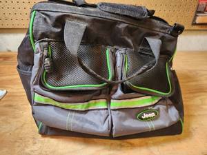 lot 490 image: Jeep Tool Bag with Various Tools and Hardware