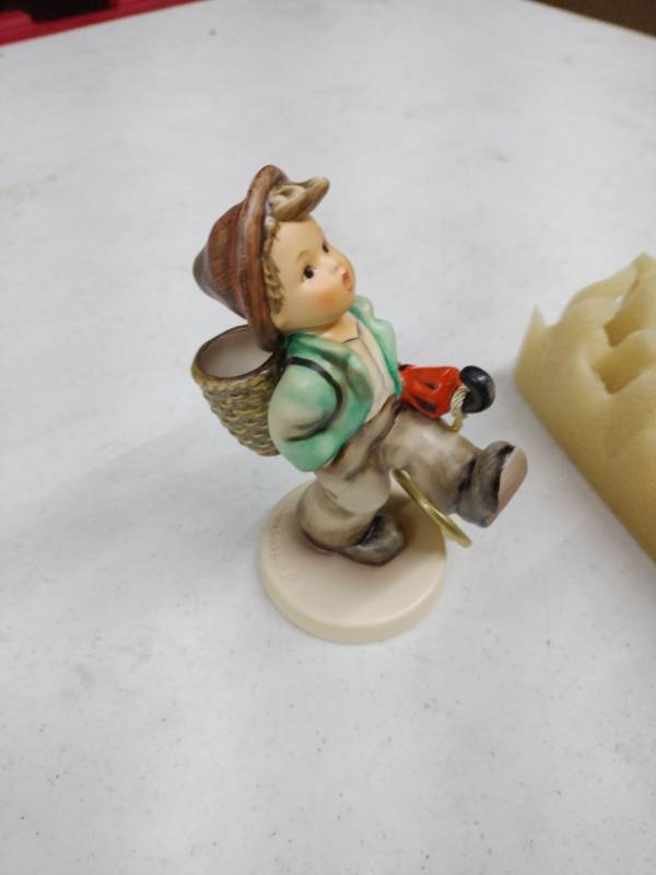 lot 35922 image: Goebel Hummel figurine titled Globe Trotter