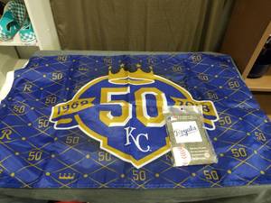 lot 1927 image: Kansas City Royals 50th Anniversary Flag and  Rainmate II Hooded Poncho