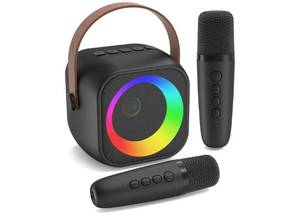 lot 64320 image: Mini Karaoke Machine, Portable Bluetooth Karaoke Speaker with 2 Wireless Microphones, Singing Machine with Party Lights for Kids. SPEAKER GRILL DISCOLORED. Powers On. - Retail $20