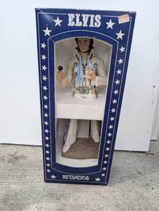 lot 551 image: Elvis McCormick Distilling Co. Portrait Doll with Lei and Hawaii Sport Shirt