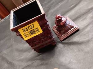 lot 33737 image: Antique carved red lacquer box featuring intricate floral relief patterns and small decorative feet