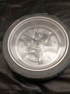 lot 33740 image: 14-inch tire rim wall clock designed to look like a car wheel with a rubber tire tread and alloy-style spoke face