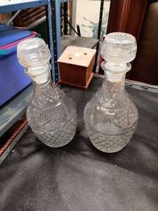 lot 33697 image: Set of two clear glass decanters with matching lids