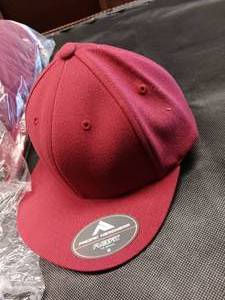lot 33715 image: Bundle of 12 red Flexfit hats size XS