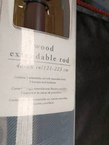 lot 33664 image: Set of two wooden extendable curtain rod package measuring 4888 inches (121223 cm)