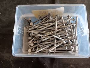 lot 33793 image: 5-pound container of Builders Choice 16D Hot-Dipped Galvanized Box Nails, which measure 3-12 inches in length