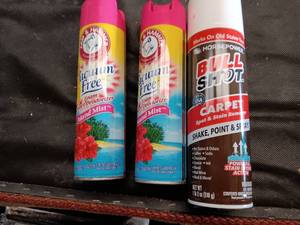 lot 33799 image: Two cans of Arm & Hammer Vacuum Free carpet deodorizer, and one can of BullShot Carpet Spot and Stain Remover