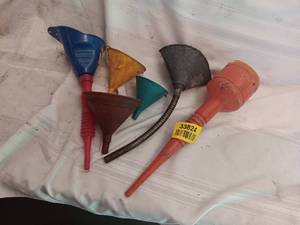 lot 33824 image: Set of assorted colored plastic and flexible funnels in various shapes and sizes.